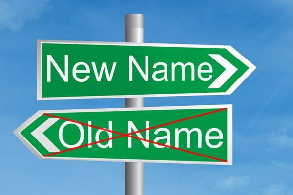 A street sign with the labels "New Name" and "Old Name" (crossed out)